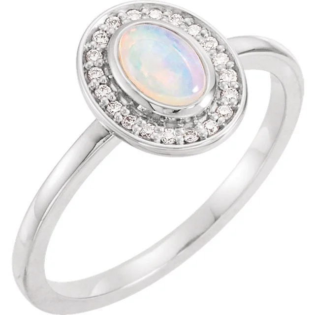 Ladies rings 1970s glow -14KT GOLD 0.95 CT MOONSTONE & 1/10 CTW DIAMOND OVAL HALO RING